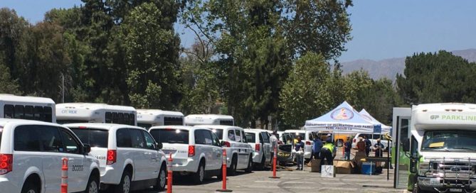 Vans lining up for Food delivery service during Covid-19 pandemic in LA